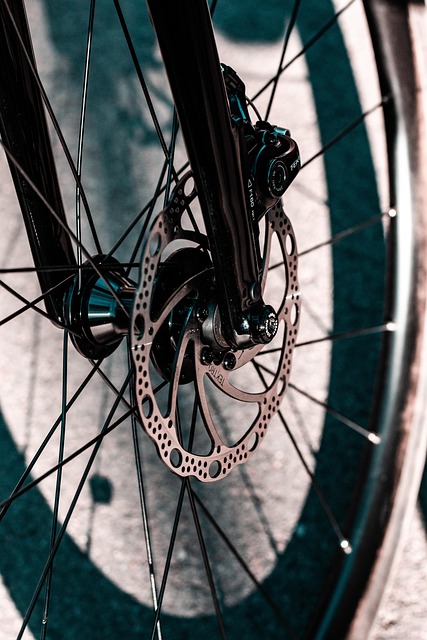 bicycle mechanic hands adjusting brake in workshop educational bike servicing